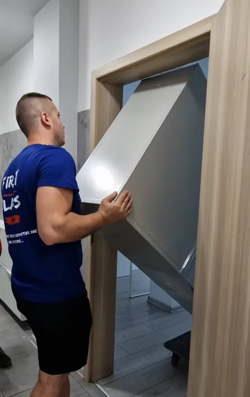 Carrying furniture through a door during a home move in Sofia